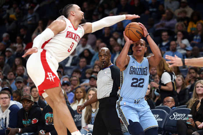 Grizzlies guard Desmond Bane shoots for three as Houston Rockets forward Dillon Brooks (9) defends during the first half at FedExForum.